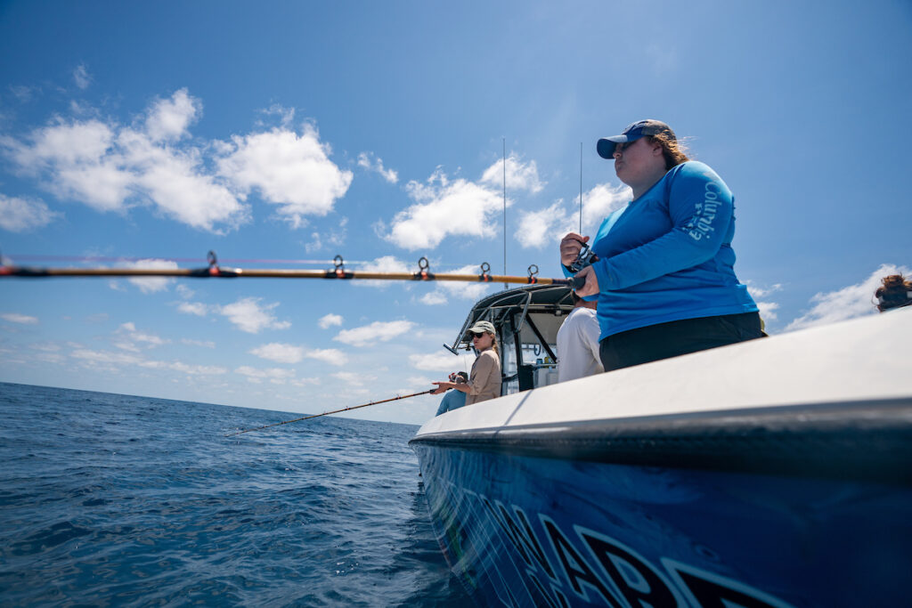 Women fishing out of a boat in the Gulf of Mexico.