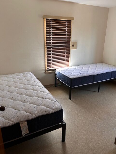 A room with two twin beds.